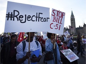 People rally against Bill C-51, the former Conservative government's anti-terror legislation, at Parliament Hill on May 1, 2015.