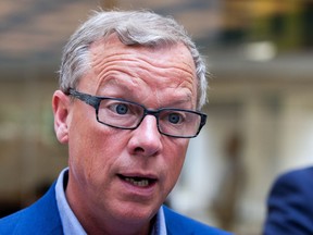 Premier Brad Wall speaks to reporters during a news conference in Prince Albert on Aug. 3.