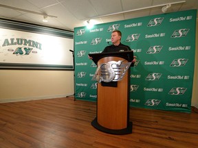 Saskatchewan Roughriders head coach-general manager Chris Jones reads a prepared statement regarding the penalties levied against the Roughriders by the CFL on Thursday.