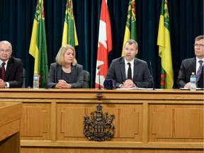 Dr. Dennis Kendel, from left, Brenda Abrametz, Health Minister Dustin Duncan  and Tyler Bragg at a news conference announcing a three- person panel that will review the province's health regions.