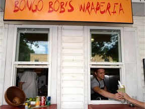 Keiffer McLean serves up a naan bread wrap at Bongo Bob's Wraperia.