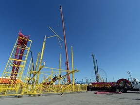 Crews setup up rides in preparation of this years' Queen City Ex in Regina on Tuesday.