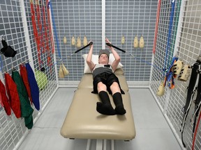 Kieran Vermeulen doing pulley exercises in the Universal Exercise Unit at First Steps Wellness Centre in Regina on Tuesday. Kieran suffered a brain injury in May 2014.