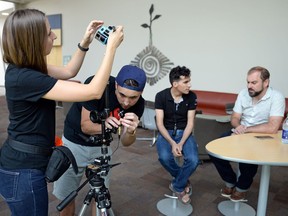 Director of photography Ann Tipper (from left), sound engineer Evan Miles, Hany al Moulia and digital director Joel McConvey film at the University of Regina on Tuesday.