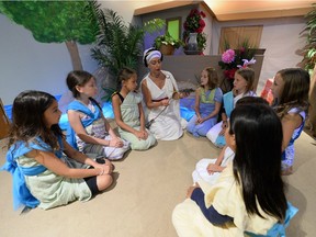 Kids take part in learning how to make a craft from 300 B.C. ancient  Greece as part of Carla Cullen's daycare in her basement in Regina on Wednesday.