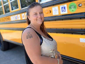 Regina Catholic Schools transportation officer Elena Chase displays her school bus tattoo.