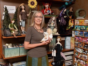 Doll maker Nancy Wirtz displays some her handmade dolls at her home in Regina.