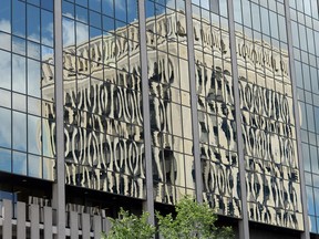 Regina City Hall reflected in a nearby building.