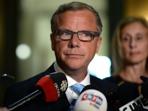Premier Brad Wall speaks to journalists at the Legislative Building about Don McMorris's resignation from cabinet and caucus after being charged with impaired driving.