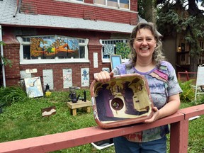 Amber Fyfe holds the smallest of her sink paintings, a replica of Kenneth Lochhead's The Bonspiel.