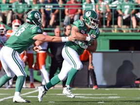 Saskatchewan Roughriders running back Matt Walter, shown accepting a handoff from Mitchell Gale, is looking forward to playing against his former Calgary Stampeders teammates on Thursday at McMahon Stadium.