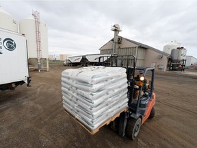 Worker moves bulk fertilizer at Crop Production Services, an Agrium crop input wholesaler in north Regina. Wholesale trade in June was down largely due to lower sales of agricultural supplies, like fertilizer and fuel.