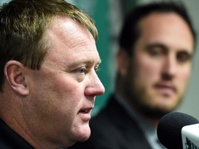 Saskatchewan Roughriders president-CEO Craig Reynolds, right, has little choice but to wait and hope that Chris Jones, left, can turn around the struggling CFL team.