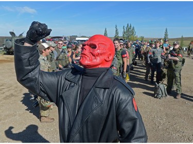 Sean Gurnsey, dressed as the Marvel character Red Skull holds up his fist at an annual Second World War paintball re-enactment of the battle for Juno Beach at Prairie Storm Paintball near Moose Jaw, Sask. on Saturday Aug. 27, 2016.