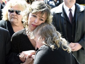 Rob Ford's widow Renata embraces their daughter Stephanie at his funeral in March.