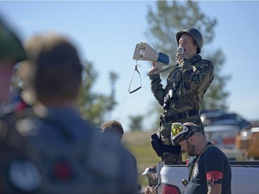 Stephen Dombowsky gives instructions to participants of an annual Second World War paintball re-enactment of "The Battle for Juno Beach" at Prairie Storm Paintball near Moose Jaw, Sask. on Saturday Aug. 27, 2016.