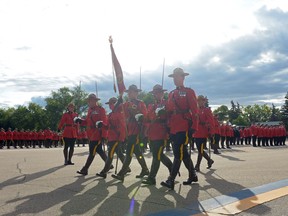 A group marches in the RCMP Guidon during the annual RCMP National Memorial Service held at RCMP "Depot" Division in Regina, Sask. on Sunday Sept. 11, 2016. MICHAEL BELL