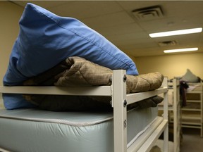 A pillow and blanket sit on a mattress at Waterston House homeless shelter in Regina.