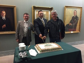 An announcement was made at the Saskchewan legislative building that two communities have been upgraded to the accredited level for the Main Street Saskatchewan Program and three have been accepted into the program on Tuesday. Pictured above (l-r) is John Gunderson, town councilor for Watrous, Ken Cheveldayoff, minister for parks, culture and sport, and Michael Botterill, deputy mayor of Nipawin, cutting a cake. Both Watrous and Nipiwan were towns that were upgraded to the accredited level.