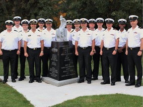 Crew members from Her Majesty's Canadian Ship Regina are currently visiting the Queen City over the weekend. Pictured above are the crew members standing in front of the Naval Memorial at HMCS Queen on Thursday evening. PHOTO SUBMITTED BY HMCS REGINA