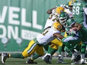 The running of Curtis Steele, right, was a major reason why the Saskatchewan Roughriders defeated the Edmonton Eskimos 26-23 in overtime on Sunday.