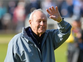 Arnold Palmer waves to fans during the Champion Golfers' Challenge on The Old Course at St. Andrews in Scotland, on July 15, 2015.