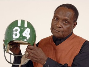 Saskatchewan Roughriders legend George Reed, shown in a file photo, poses with his helmet from the Saskatchewan Sports Hall of Fame.