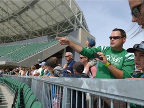 Jason Evert points toward the field during a public visit to the new Mosaic Stadium in Regina, Sask. on Saturday Sept. 3, 2016.