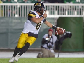 Jeremiah Masoli of the Hamilton Tiger-Cats celebrates a 21-yard touchdown run, which came on a third-and-one situation, Saturday against the host Saskatchewan Roughriders. The Tiger-Cats' excitement was short-lived, though, as the Roughriders ended up winning 20-18.