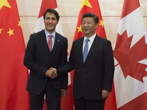 Chinese President Xi Jinping welcomes Prime Minister Justin Trudeau to the Diaoyutai State Guesthouse in Beijing in August.