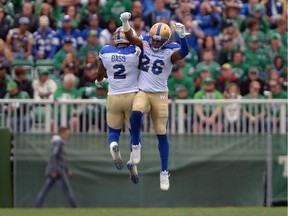 Khalil Bass (2) and Tony Burnett (26) of the Winnipeg Blue Bombers, shown here celebrating during the Labour Day Classic on Sunday at Mosaic Stadium, will look for the series sweep against the Saskatchewan Roughriders on Saturday.
