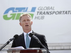 John Law speaks during a news conference at the Global Transportation Hub in this 2012 file photo. Law was named a senior fellow at the Canada West Foundation.