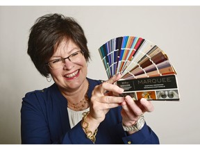 Paint colour guru Nancy Bollefer of Behr Paints holds an array of paint colour samples. Today's paint colours are inspired by current trends in fashion and decor, she explains.