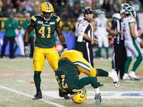 Edmonton Eskimos defensive linemen Odell Willis (41) and Jabari Hunt (76), shown here celebrating a sack against the Saskatchewan Roughriders on Aug. 26, will be looking Sunday for a sweep of the season series against Saskatchewan.