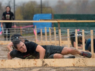 People participate in Mud, Sweet & Tears in Lumsden, Sask. on Saturday Sept. 24, 2016.