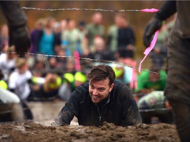 People participate in Mud, Sweet & Tears in Lumsden, Sask. on Saturday Sept. 24, 2016.