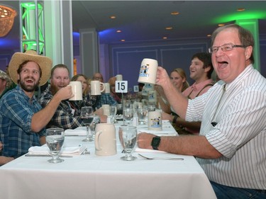 People toast at Sasktoberfest held at the Hotel Saskatchewan in Regina, Sask. on Saturday Sept. 10, 2016.