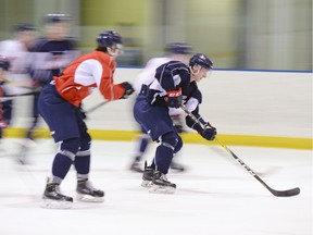 Regina Pats left-winger Riley Woods (in blue) and his teammates practised Tuesday at the Co-operators Centre.