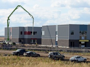 Plainsview School/St. Nicholas School is pictured under construction on Tuesday in Rosewood Park in northwest Regina. The red is the public school; the light blue is the Catholic school.