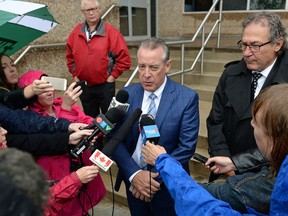Former deputy premier Don McMorris talks to reporters outside court after pleading guilty to impaired driving and receiving a fine of $1,820 and a one-year licence suspension.