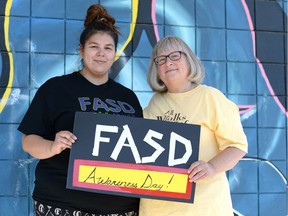 Midori Harth, left, and her mother, Lisa Brownstone, were at a FASD Awareness Walk in Regina on Friday.