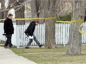Members of the Regina police service in the 600 block of Retallack Street after a suspicious death in the area in Regina on April 22, 2015.