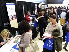 A job fair held in Regina this spring attracted lots of job-seekers. Manpower's latest survey says hiring will be subdued in the fourth quarter.