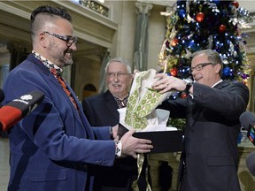 Orest Gawdyda, left, vice-president of the Ukrainian Canadian Congress, presents Premier Brad Wall with a gift during a January announcement marking 2016 as the Year of Saskatchewan Ukrainians.