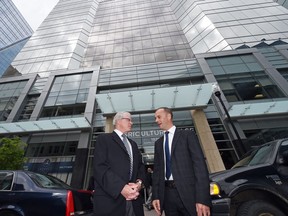 Michael Hoffort (R), president and CEO of Farm Credit Canada, the main tenant of Agriculture Place at 1820 Hamilton Street, and Paul Hill, president and CEO of The Hill Companies, which developed the project. While Agriculture Place created some vacancy in the downtown core, that space is being absorbed according to Re/Max.