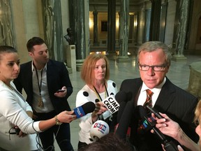 Premier Brad Wall speaks to reporters Monday at the Legislative Building in response to the merger announcement by Potash Corp. of Saskatchewan and Agrium Inc. Credit: Bruce Johnstone, Regina Leader-Post