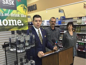 Jeremy Harrison, minister responsible for the Saskatchewan and Liquor and Gaming Authority announces liberalization of the regulations around craft wineries and distilleries, watched by Barb and John Cote, who run the Black Fox Farm and Distillery southwest of Saskatoon.