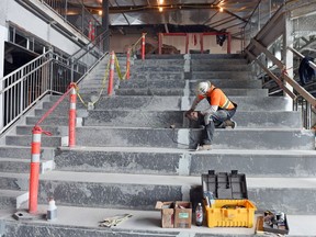 David Grondin works on the presentation stairs area during a tour of the new joint-use Ecole Harbour Landing School and St. Kateri Tekakwitha Catholic School in southwest Regina on Sept. 12, 2016.