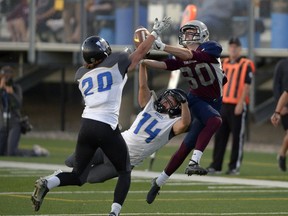 Regina Thunder receiver Kris Calcutt (80) comes very close to making a reception while Winnipeg Rifles defensive back Brandon Gates (14) covers him at Leibel Field on Saturday.