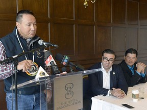 FSIN Chief Bobby Cameron (right ) and Stavros Daskos, president of Encanto (centre), look on as Muskowekwan Chief Reg Bellerose tells a news conference about Encanto's proposed potash mine on the Saskatchewan First Nation, 100 km northeast of Regina.